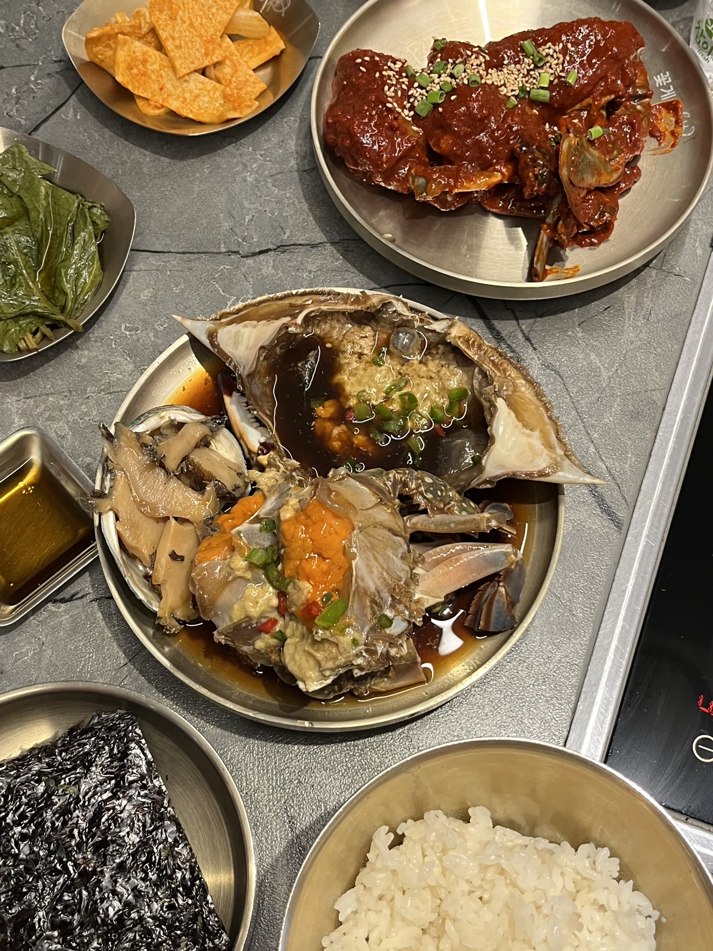 Soy-marinated and spicy crab, side by side. The pairing the D Set is built around.