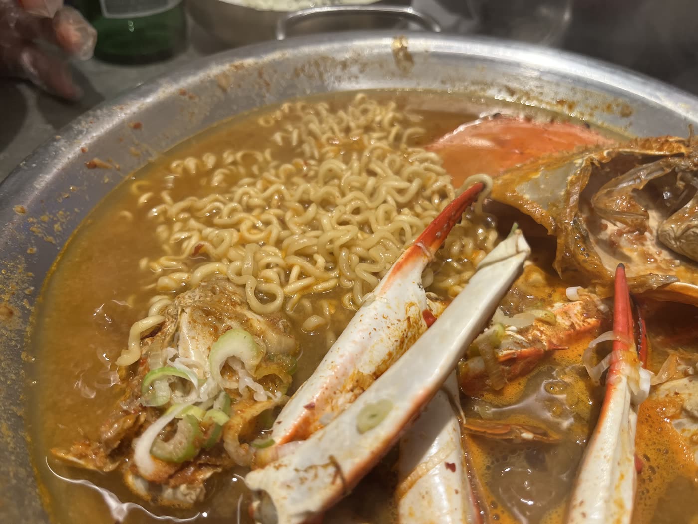 Ramyeon noodles going into the crab stew