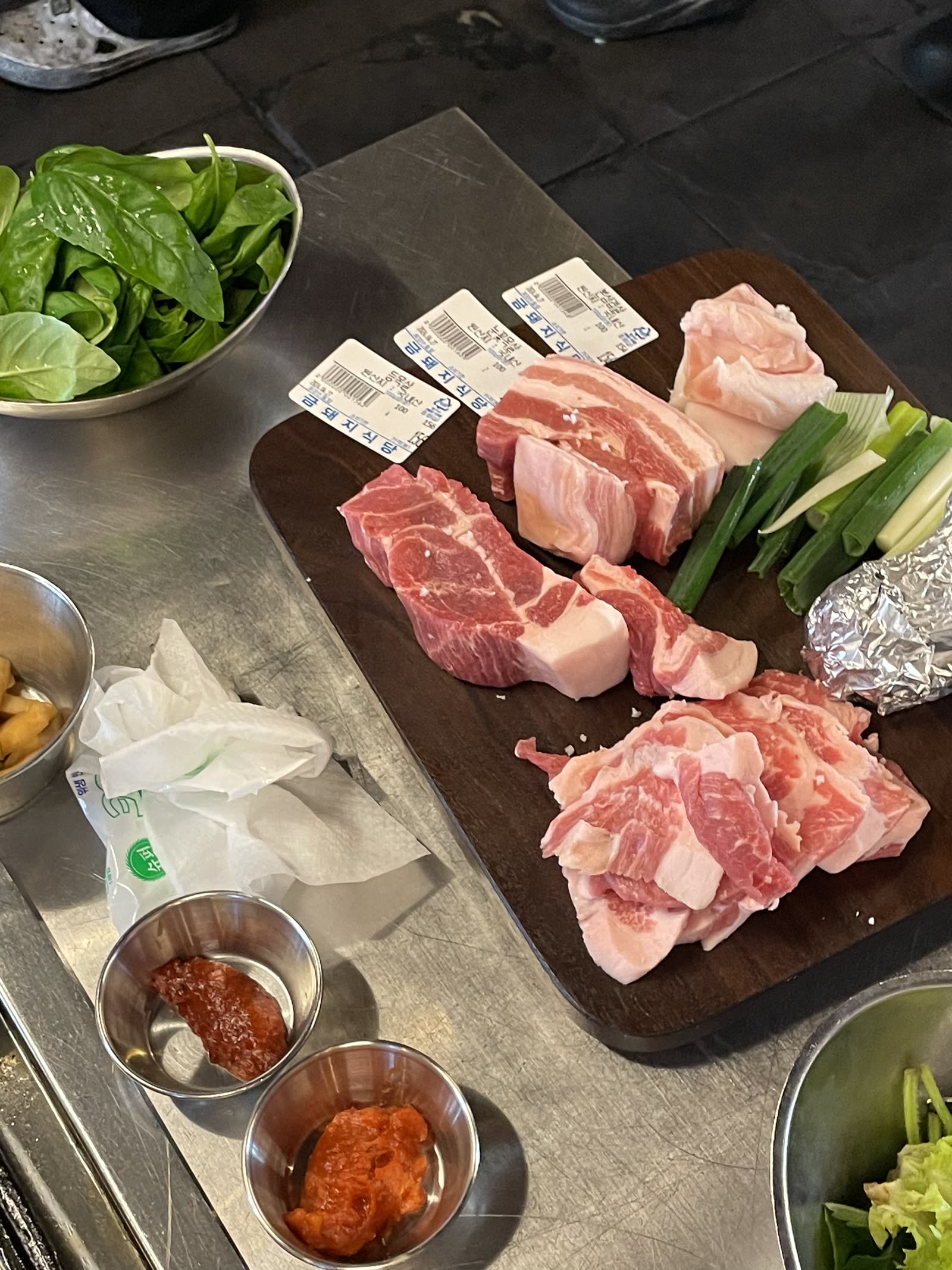 Cuts arrive tagged, so you can see what goes on the grill. Geumdwaeji Sikdang. Photo by Jeong, Korea