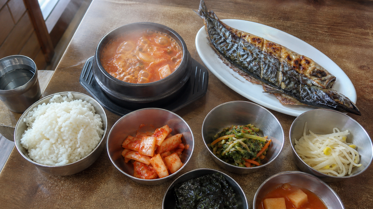 Grilled mackerel and kimchi jjigae — an ordinary Korean weekday lunch.