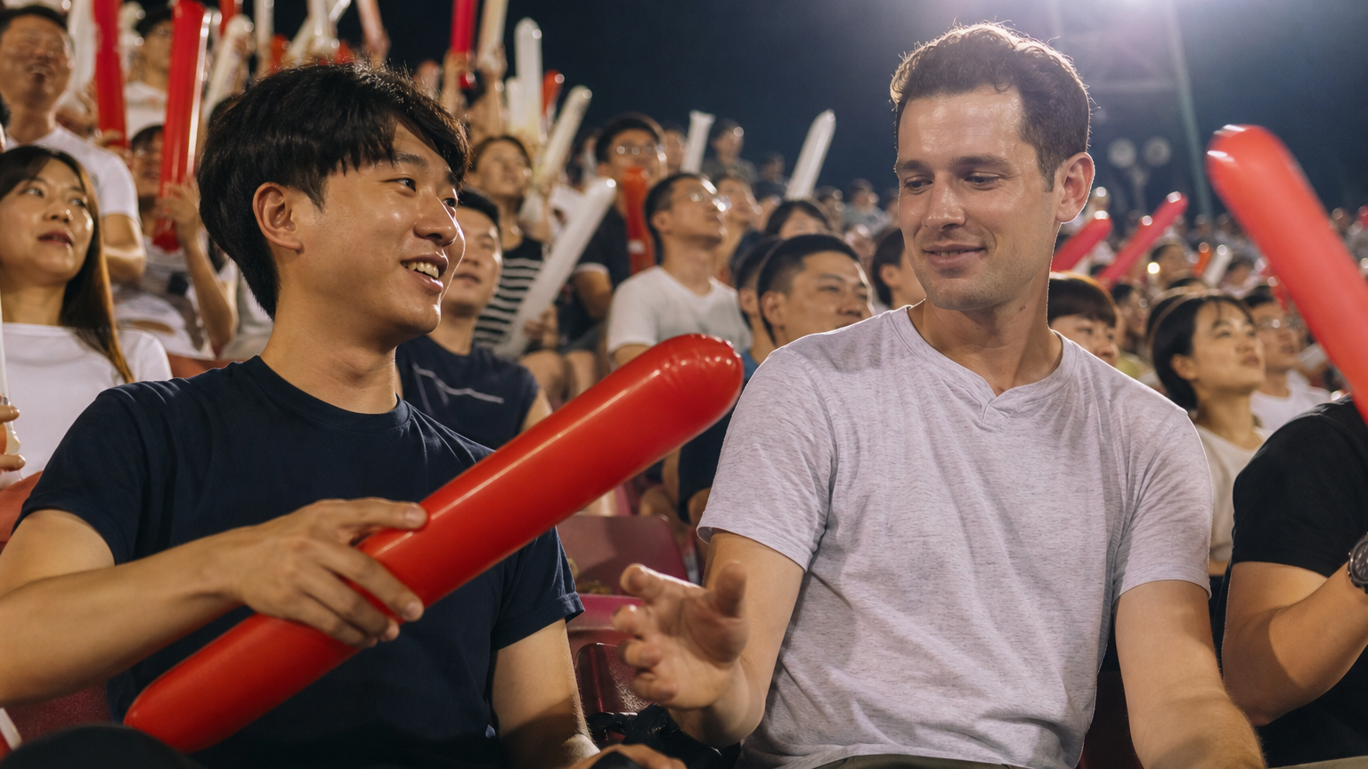 Someone hands you a cheering stick, and you copy what they do with it.