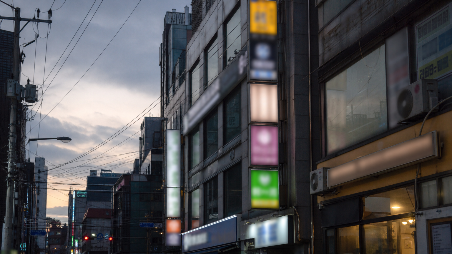 A Seoul building stacked with clinic signboards — most Korean clinics sit upstairs, not on the street