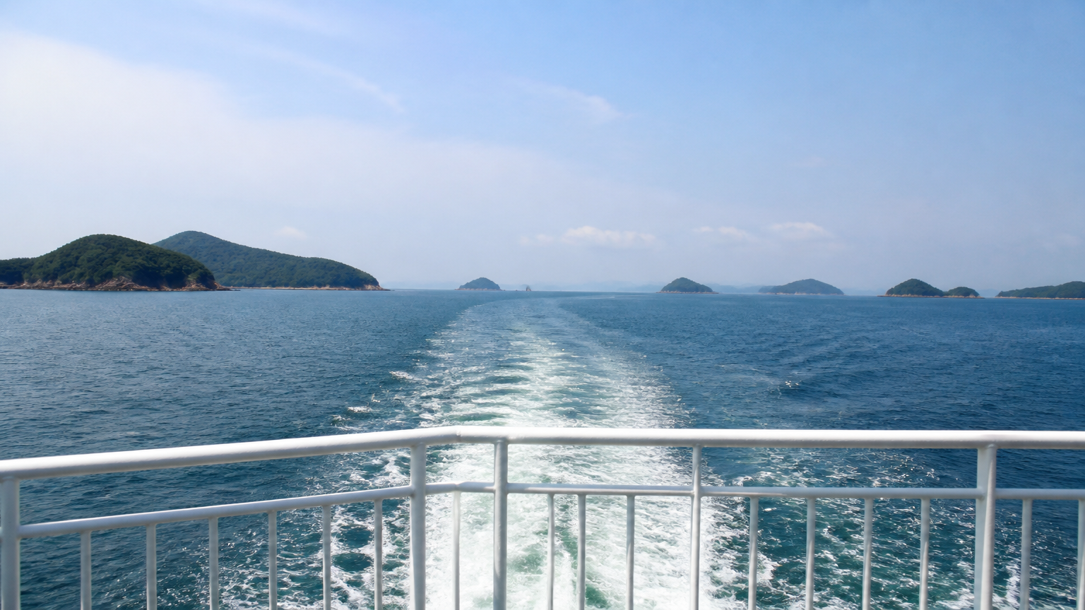 The southern sea from the deck, islands scattered to the horizon.