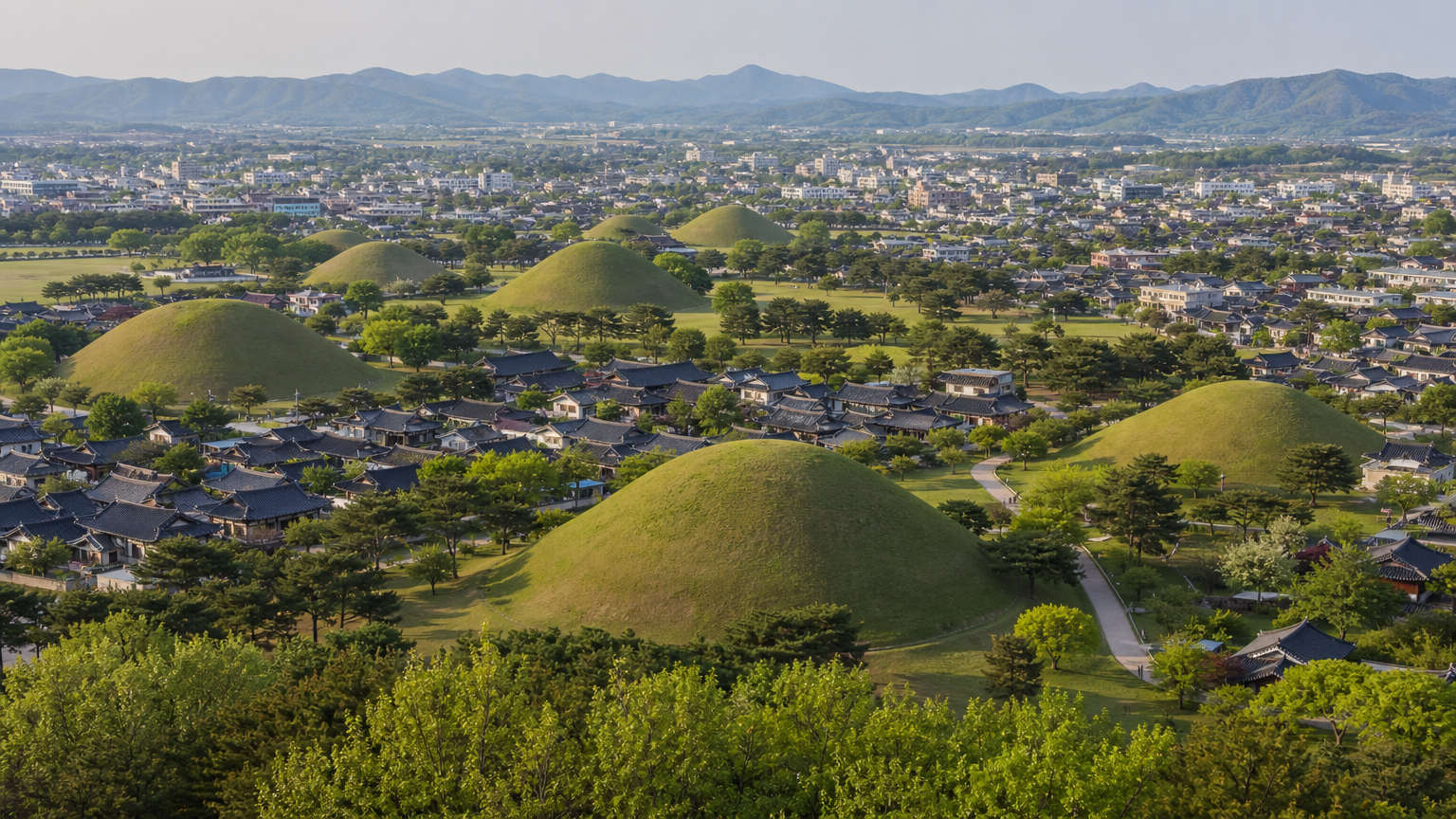 The royal tombs are not fenced off in a park on the edge of town. They sit among the streets of a working city.